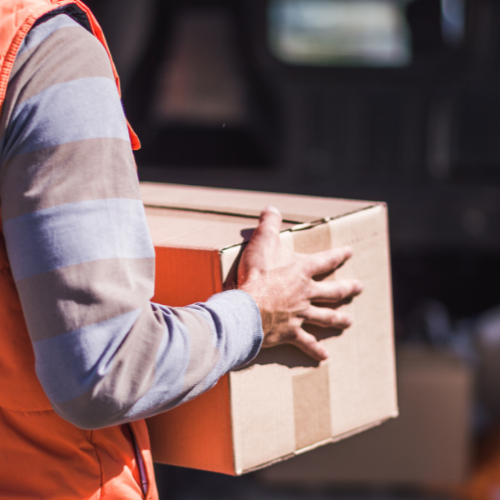 Cardboard box being carried